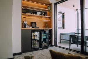 a room with a bar and a dining table at Appartementhaus Absmeier in Bad Füssing