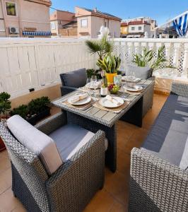 a table and chairs sitting on a patio at Apartment-House La Mata Torrevieja in Torrevieja