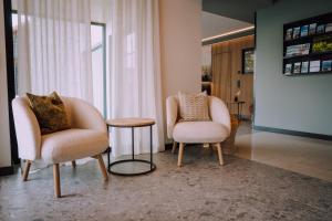 two chairs and a table in a room at Appartementhaus Absmeier in Bad Füssing +103 photos