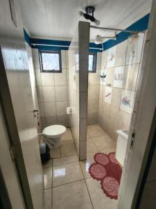 a small bathroom with a toilet and a shower at ECO BROTAS Pousada e Rafting in Brotas +23 photos