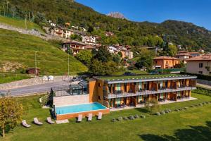 an aerial view of a resort building with a swimming pool at Como home residence in Carlazzo