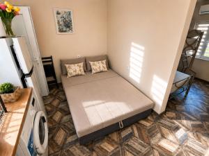a small bedroom with a bed in a room at Teo's house in Asprovalta