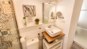 a bathroom with a sink and a toilet at Vejer de la Frontera Luis in Vejer de la Frontera +12 photos