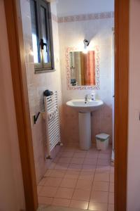 a bathroom with a sink and a mirror at B&B Salento Vacanze in Maglie +35 photos
