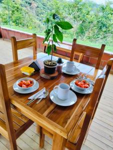 a wooden table with plates of food on it at Ecolodge Ix Cacao in San Carlos +31 photos