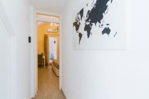 a room with a map of the world on the wall at Arco Suite - Lecce Selection in Lecce