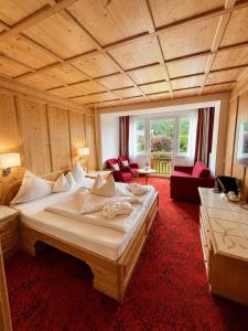 a bedroom with a large bed in a room at Hotel Latini in Zell am See +106 photos