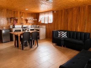 a living room with a table and a couch at Böttger Haus in Oxapampa