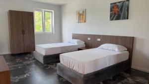 a bedroom with two beds and a window at CHM Boarding Worms in Worms
