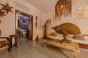 a living room with a couch and a table at Casa Moraira in Cartagena de Indias