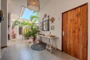 a room with a desk and a wooden door at Casa Moraira in Cartagena de Indias +36 photos