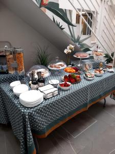 a table with a buffet of food on it at La Corte del Fante in Marsala