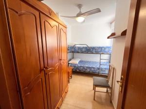 a hallway with a room with two bunk beds at Spacious Apartment in Barbate - Terrace with Sea View in Barbate
