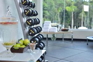a room with a bunch of dumbbells on a wall at Falls Iguazú Hotel in Puerto Iguazú