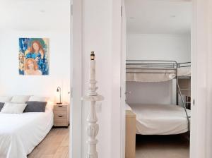 a bedroom with a bed and a bunk bed at Comfortable Studio in Santiago do Cacém, private pool, 65 m² in Santiago do Cacém