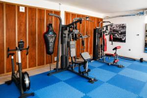 a gym with several treadmills and other exercise equipment at AB Business Hôtel in Nouakchott