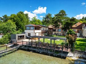 a house on the water with a dock at Royal Mediterran in Siófok