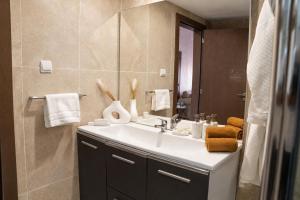 a bathroom with a sink and a mirror at AB Business Hôtel in Nouakchott +21 photos