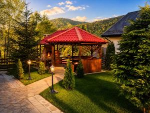 a gazebo in the yard of a house at Old Mark's House Sinaia in Sinaia
