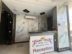 a restaurant with a sign on the wall at Middle east panorama jacuzzi & spa in Cairo