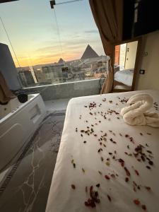a bedroom with a bed with a towel on it at Middle east panorama jacuzzi & spa in Cairo +88 photos