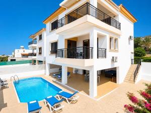 an image of a villa with a swimming pool at Villa Serena in Pomos