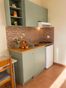 a kitchen with a sink and a counter top at Anastasis Apartments in Trapezaki +37 photos