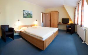 Ένα ή περισσότερα κρεβάτια σε δωμάτιο στο Hotel Familie Billenkamp
