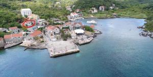 an aerial view of a small island in a body of water at BlueWave Apartments in Tivat