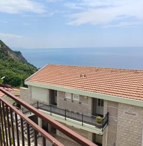a balcony of a house with a red roof at Villa Palma in Prijevor