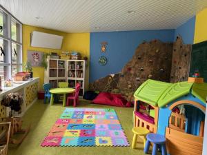a childs play room with a rock climbing wall at Erholung pur bieten Schwarzwaldoase und Murgidylle in Baiersbronn