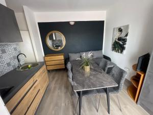 a small living room with a table and a couch at Apartments Esperanza in Pašman