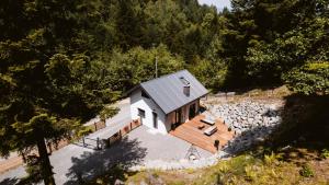 an overhead view of a house with a stone wall at Domek pod Głazami in Ostre