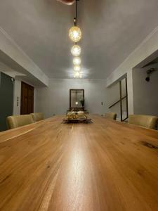 an empty room with a large wooden table and chairs at Villa Dino in Kalithies