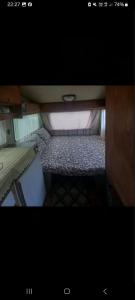 a small room with a small bed in it at kamp andrea in Šavnik