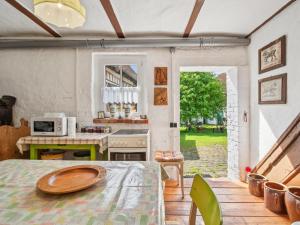 a kitchen with a table with a plate on it at Die Obermühle in Sangerhausen