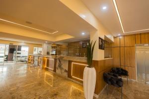 a large kitchen with a vase with a plant in it at Dodos Hotel Services in Port Harcourt +26 photos