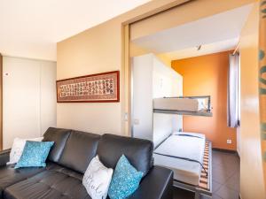 a living room with a couch and a bunk bed at Beth gelijkvloers in Sint-Idesbald +9 photos