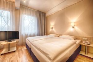 Voodi või voodid majutusasutuse enjoy hotel Berlin City Messe toas