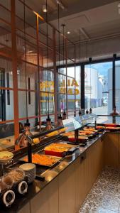 a buffet line with many different types of food at Stay-Inn Bielefeld Zentrum in Bielefeld