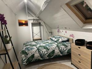 a small bedroom with a bed and a dresser at L’escale féerique in Auxerre +32 photos