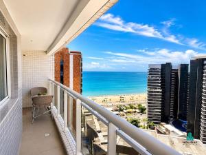 a balcony with a view of the ocean at My Way by Holiday Stays in Fortaleza