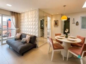 a living room with a couch and a table at My Way by Holiday Stays in Fortaleza