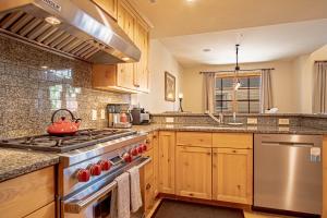 a kitchen with a stove with a tea kettle on it at Elkhorn View Retreat in Sun Valley