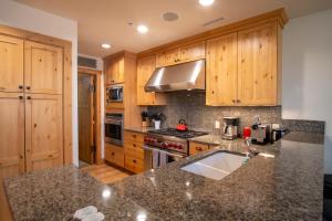 a kitchen with wooden cabinets and a counter top at Elkhorn View Retreat in Sun Valley