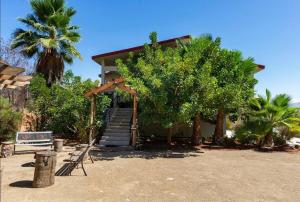 a house with a staircase leading up to a house at La Casa Del Valle in Francisco Zarco