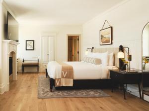 a bedroom with a large bed and a fireplace at Hotel Viking in Newport +37 photos