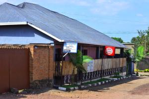 a building with a sign on the side of it at Brabus Appartment Motel in Rubavu