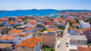 an aerial view of a town with orange roofs at Garden House Vodice in Vodice