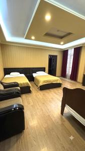 a room with three beds in a room with at Zarina Hotels & Hamam in Batumi +37 photos